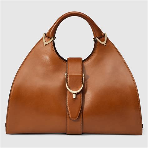 gucci lady stirrup top handle bag